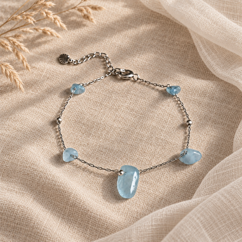 Zilverkleurige armband Dune met blauwe aquamarijn en schelpje