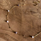 Goudkleurige ketting Isla Paars met roze en paarse kraaltjes