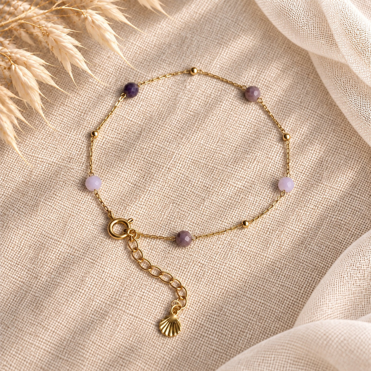 Armband Isla met verschillende paarse kraaltjes en gold filled spacerkralen